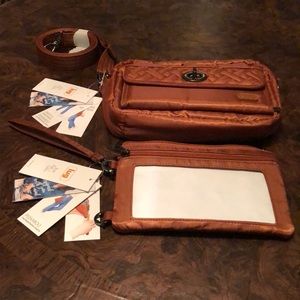 A small lug brown crossbody with a included peak-a-boo pouch.